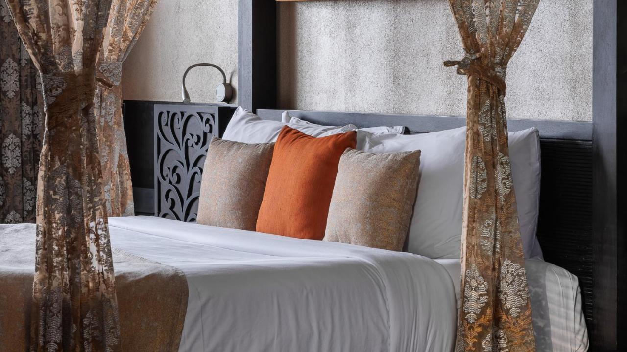 The Panoramic Getaway Hotel Munnar Ngoại thất bức ảnh A bed with cushions