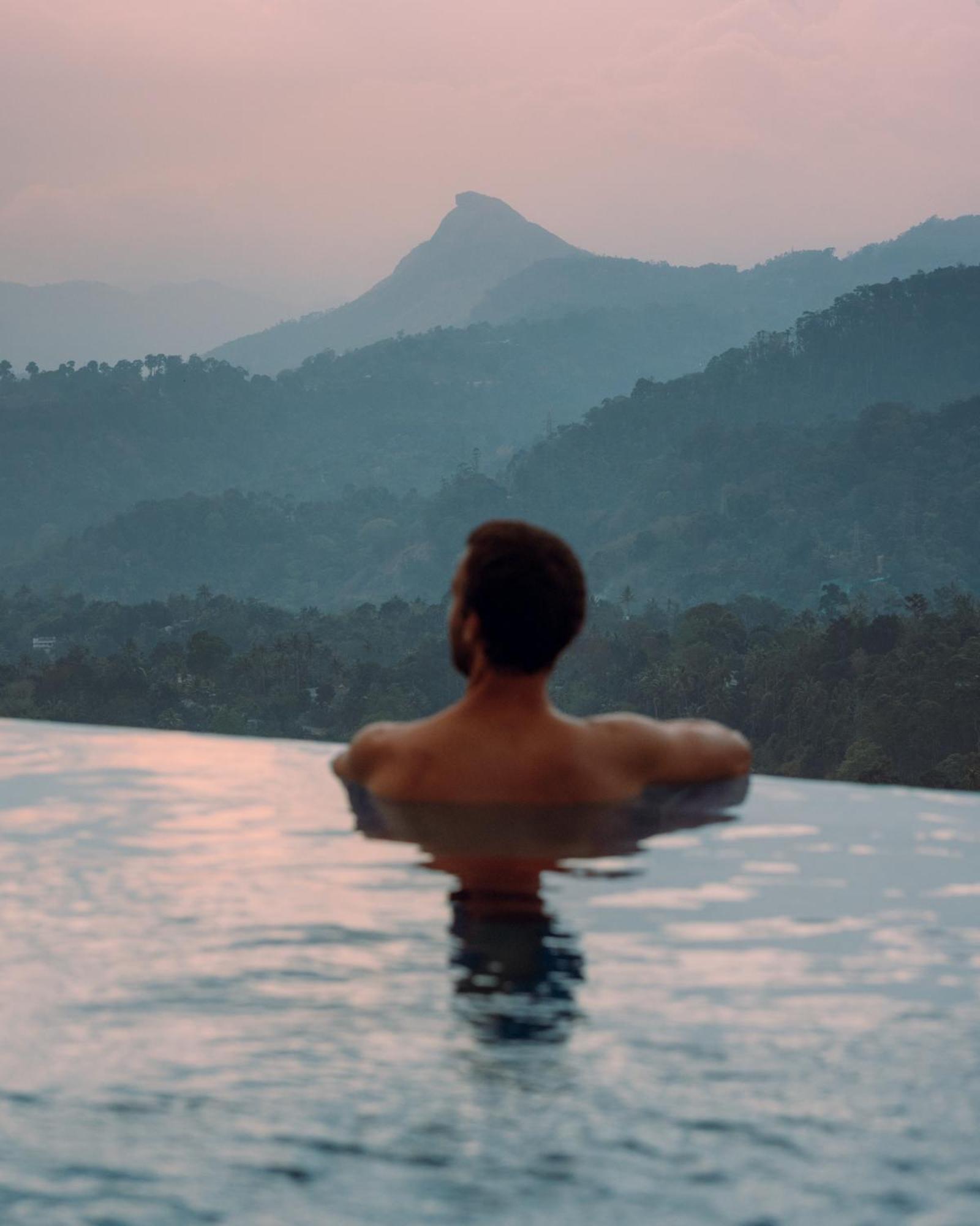 The Panoramic Getaway Hotel Munnar Ngoại thất bức ảnh A man in a swimming pool